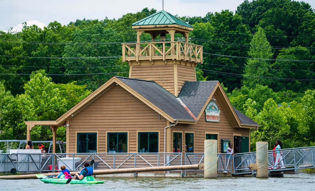 a building with a boat and a bell tower