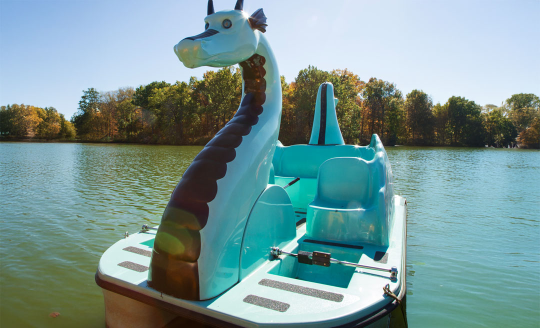 a boat with a dragon head on it
