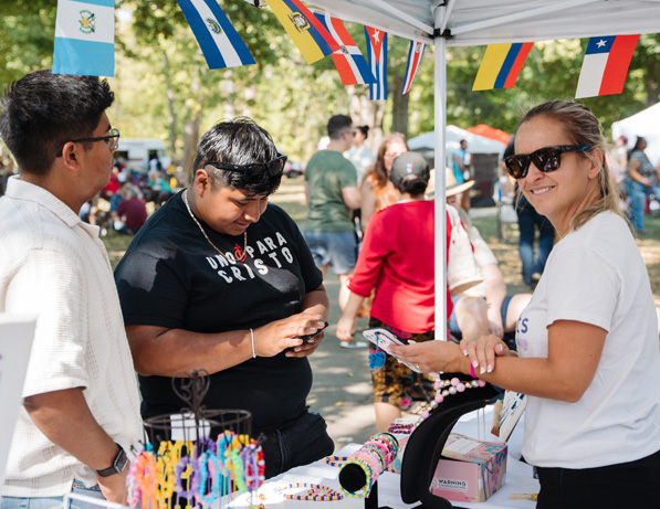 a group of people at a booth